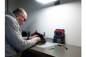 Technician cleaning an underwater housing