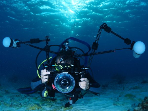 underwater housing setup with strobes lights and conversion lenses